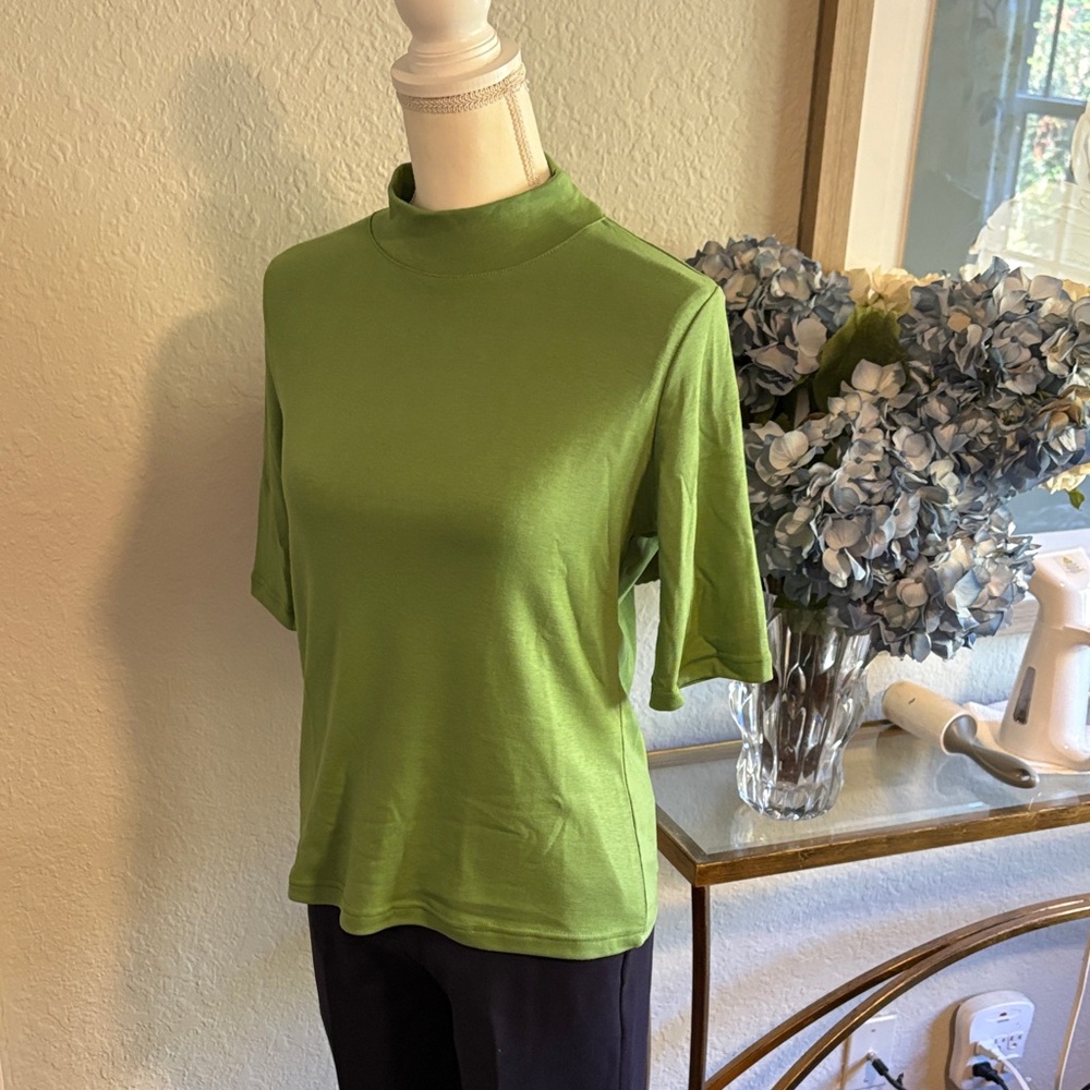 Green mock neck, polycotton knit, three-quarter sleeve top. Size medium. NWOT